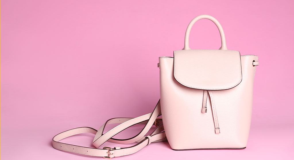 shop; pretty; elegant; lady; casual; element; girl; classic; detail; lifestyle; texture; female; color; woman; rucksack; copy; space; pink; light; accessory; vogue; trend; contemporary; trendy; stylish; object; style; background; beautiful;